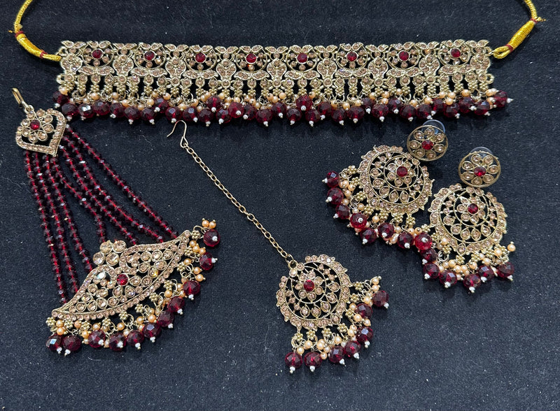 PA7803 Maroon with full gold colour choker comes with earrings tikka and jhumar