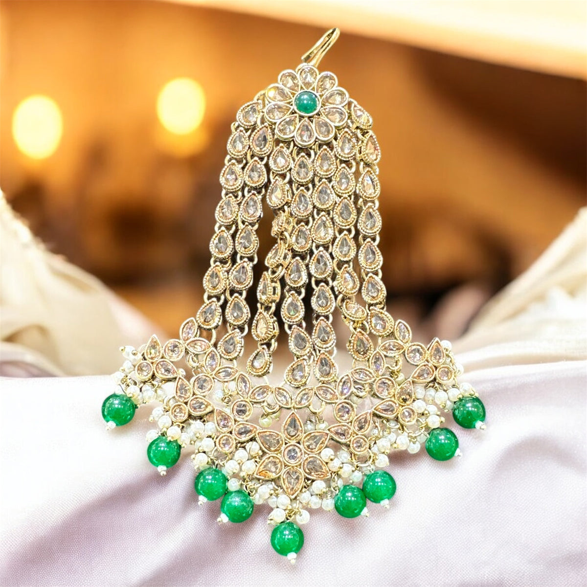 AA47 Full gold colour jhumar with green beads