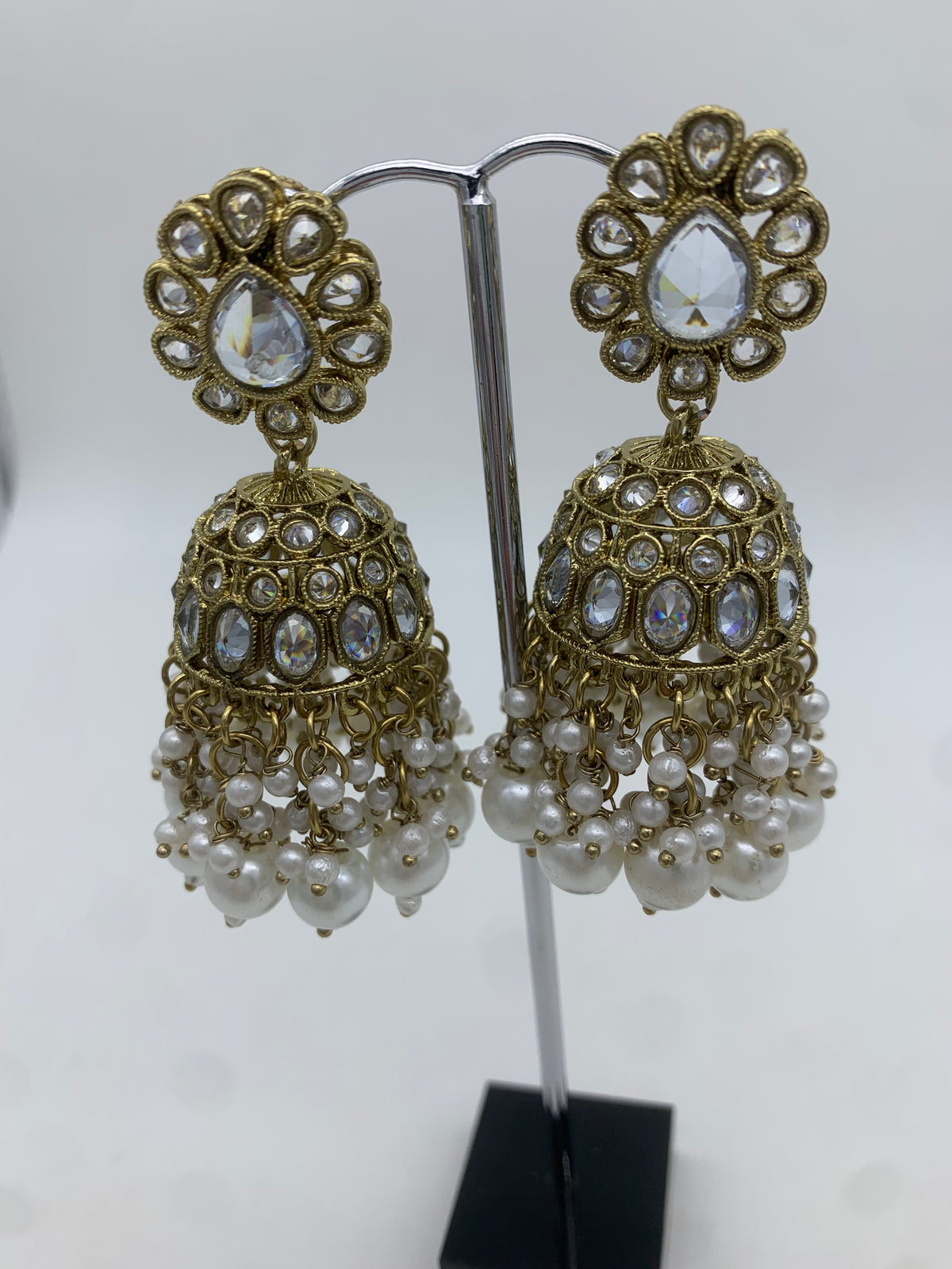 Gold and white jhumka earrings