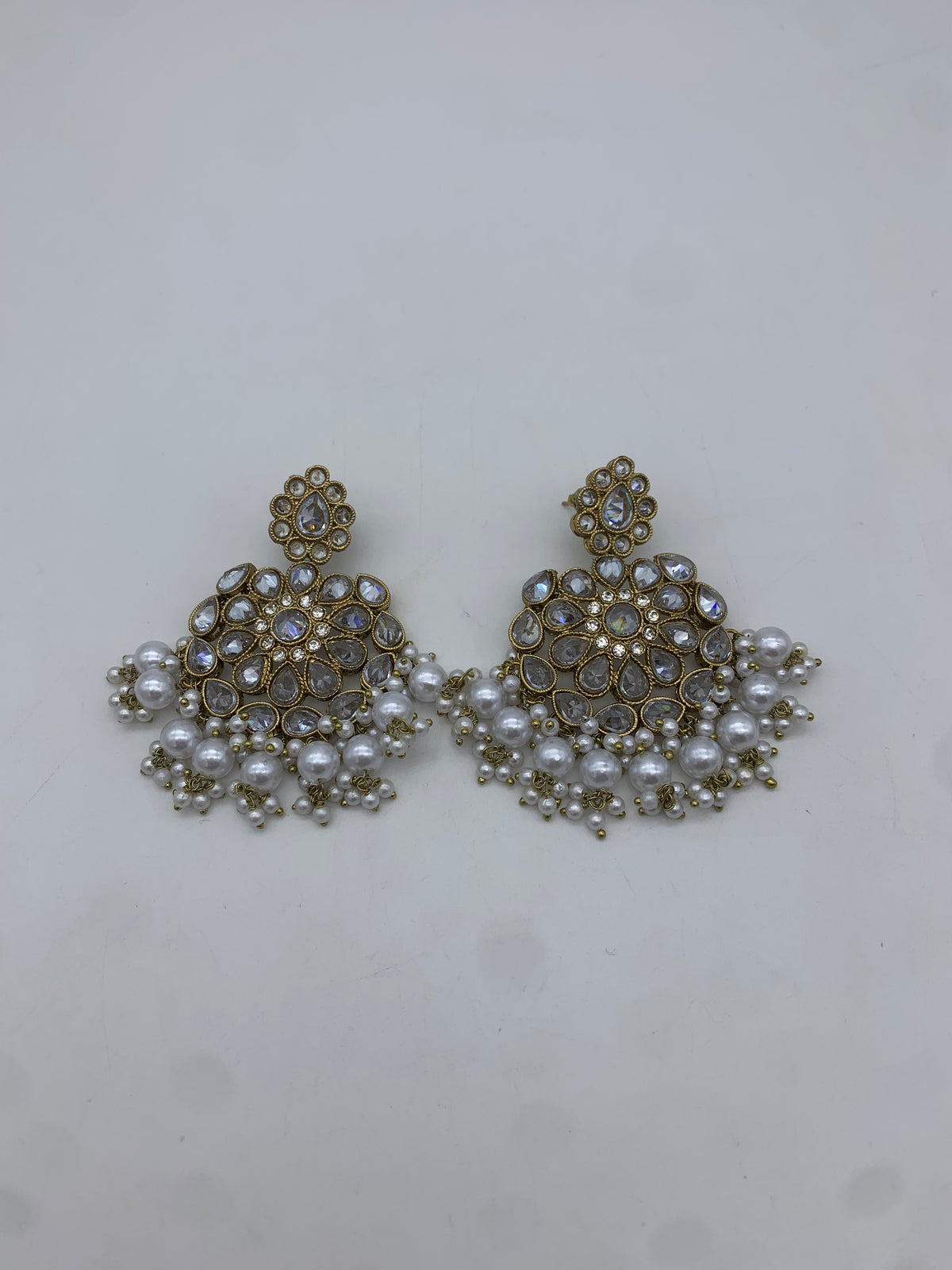 Gold and white earrings