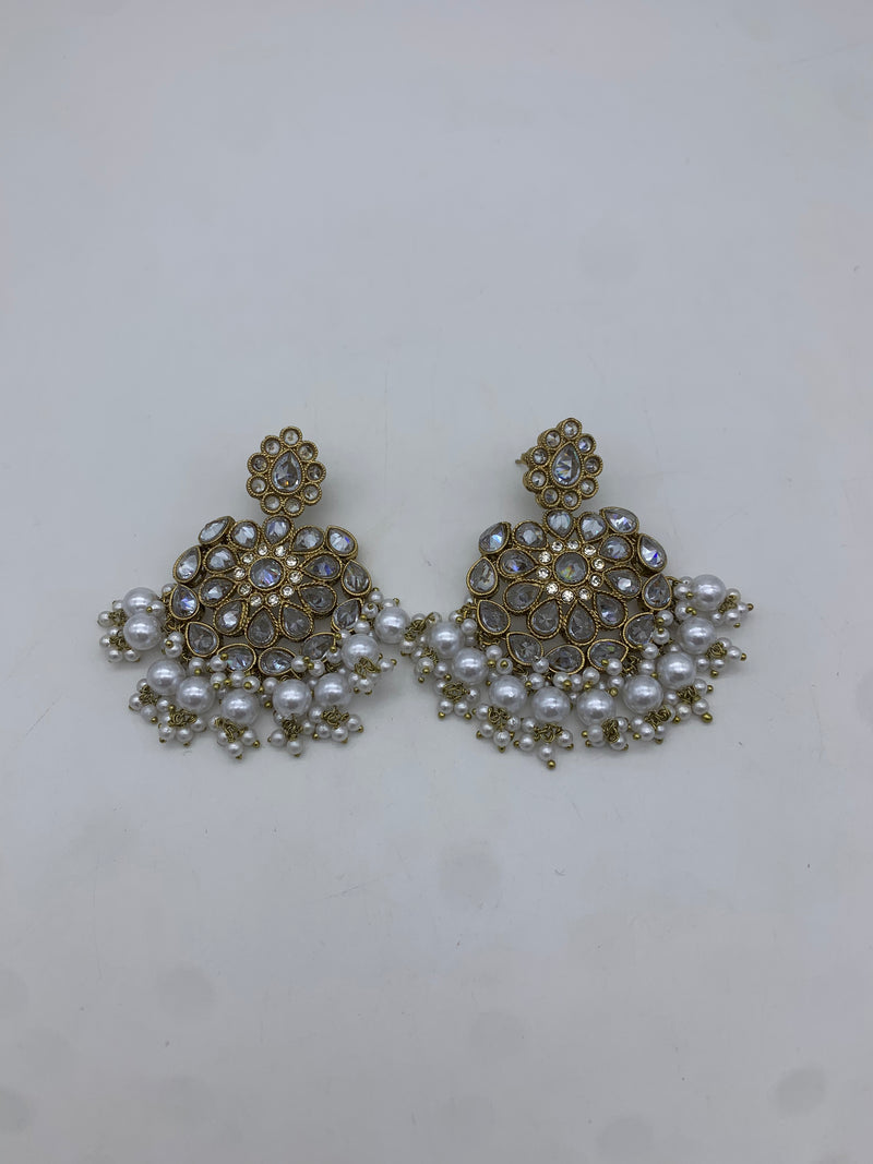 Gold and white earrings