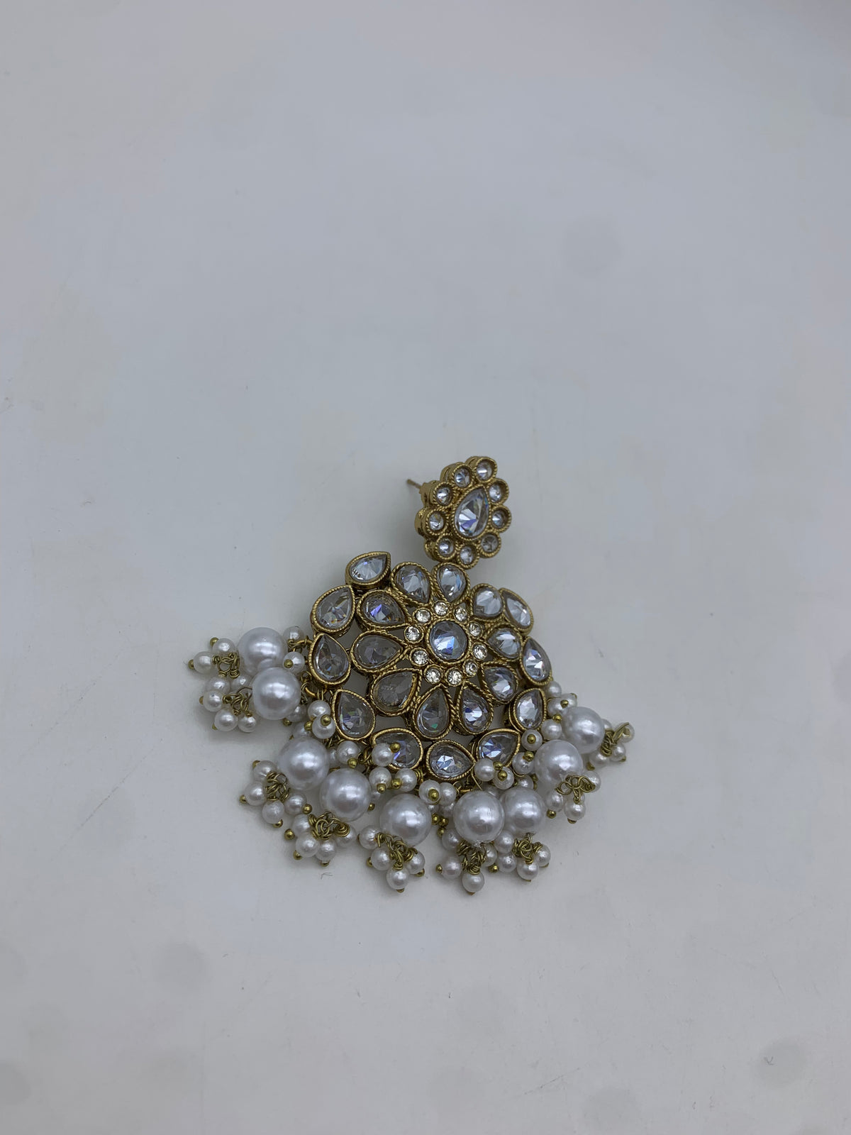 Gold and white earrings