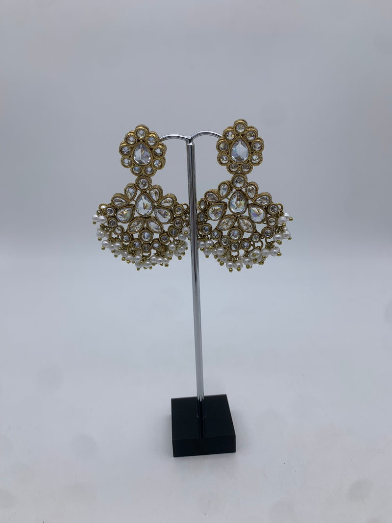 Gold and white earrings