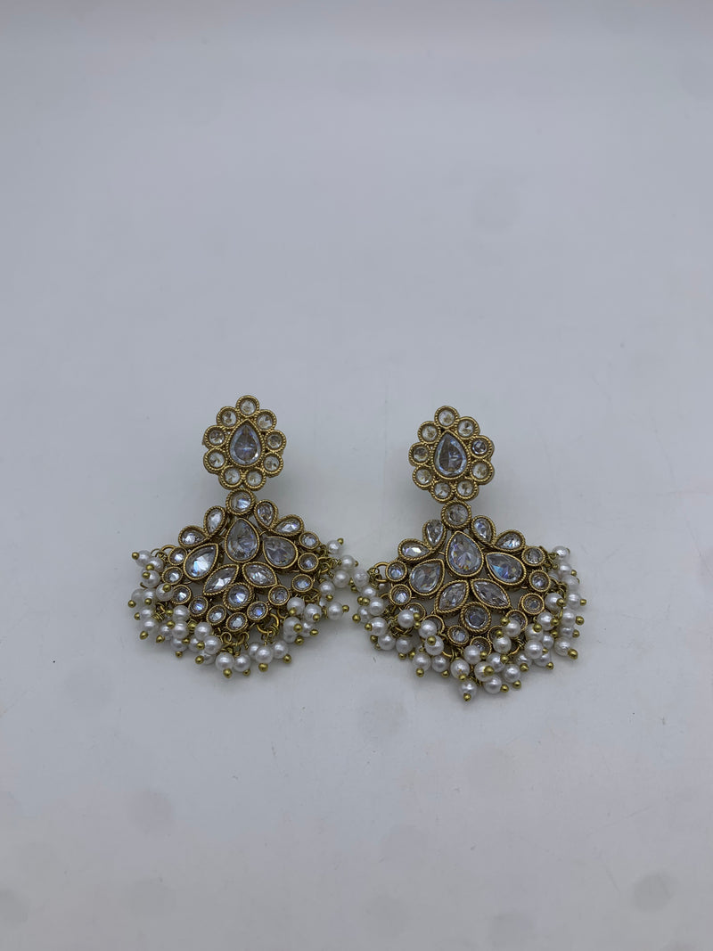 Gold and white earrings