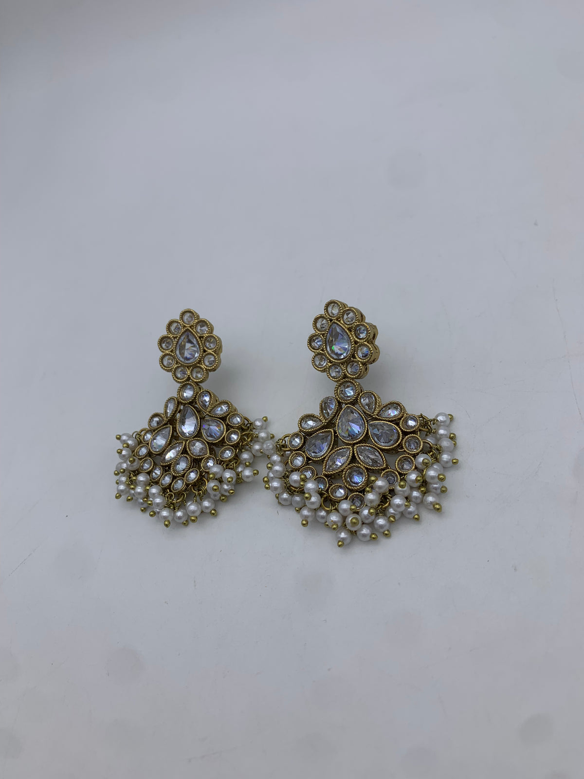 Gold and white earrings