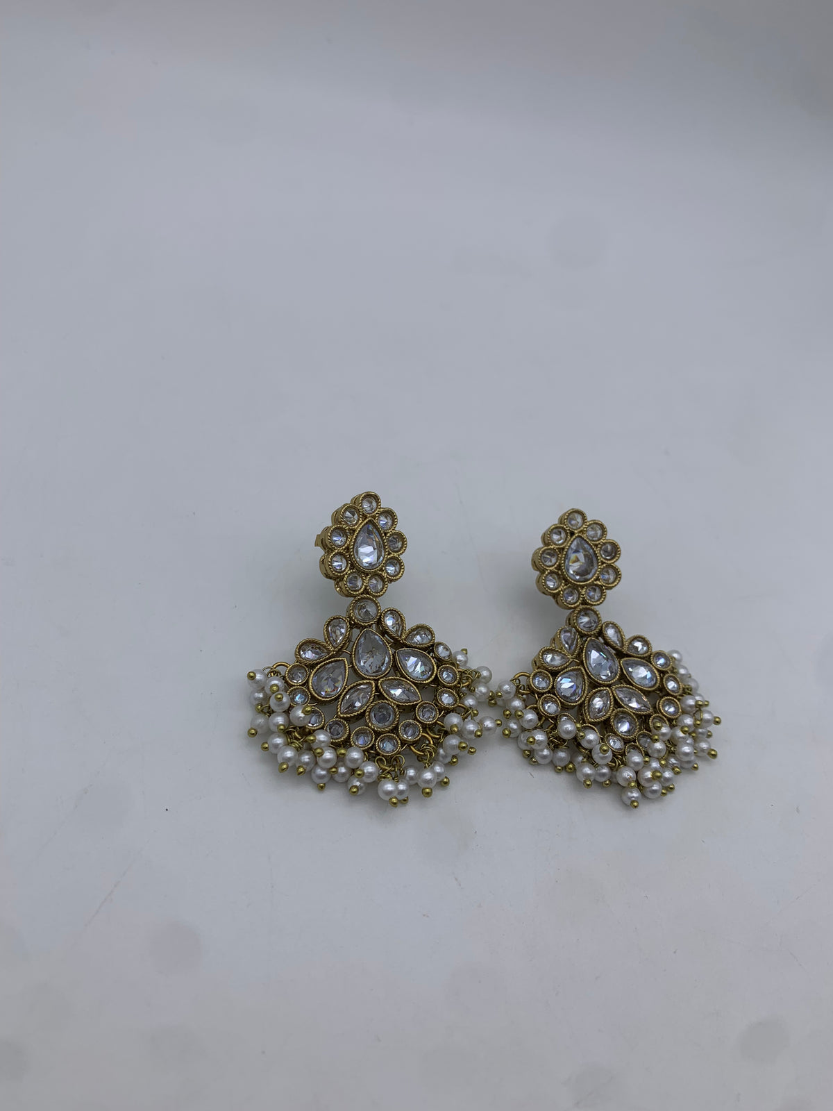 Gold and white earrings