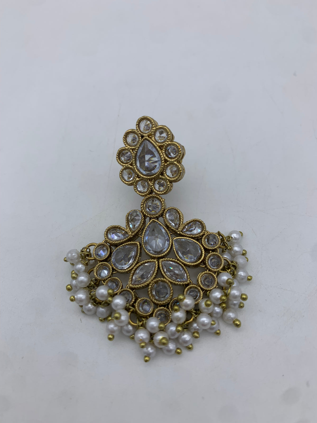 Gold and white earrings